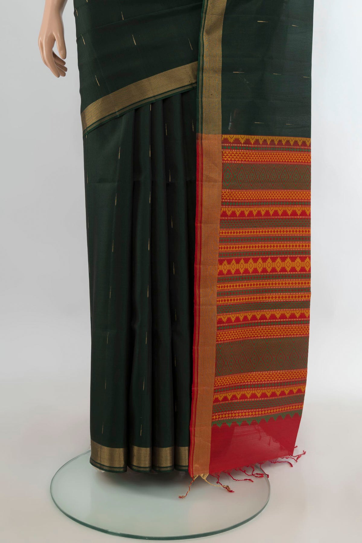 Pleats and pallu of Pure Silk Bottle Green Soft Saree with Zari Butta on the body and Zari Border. 