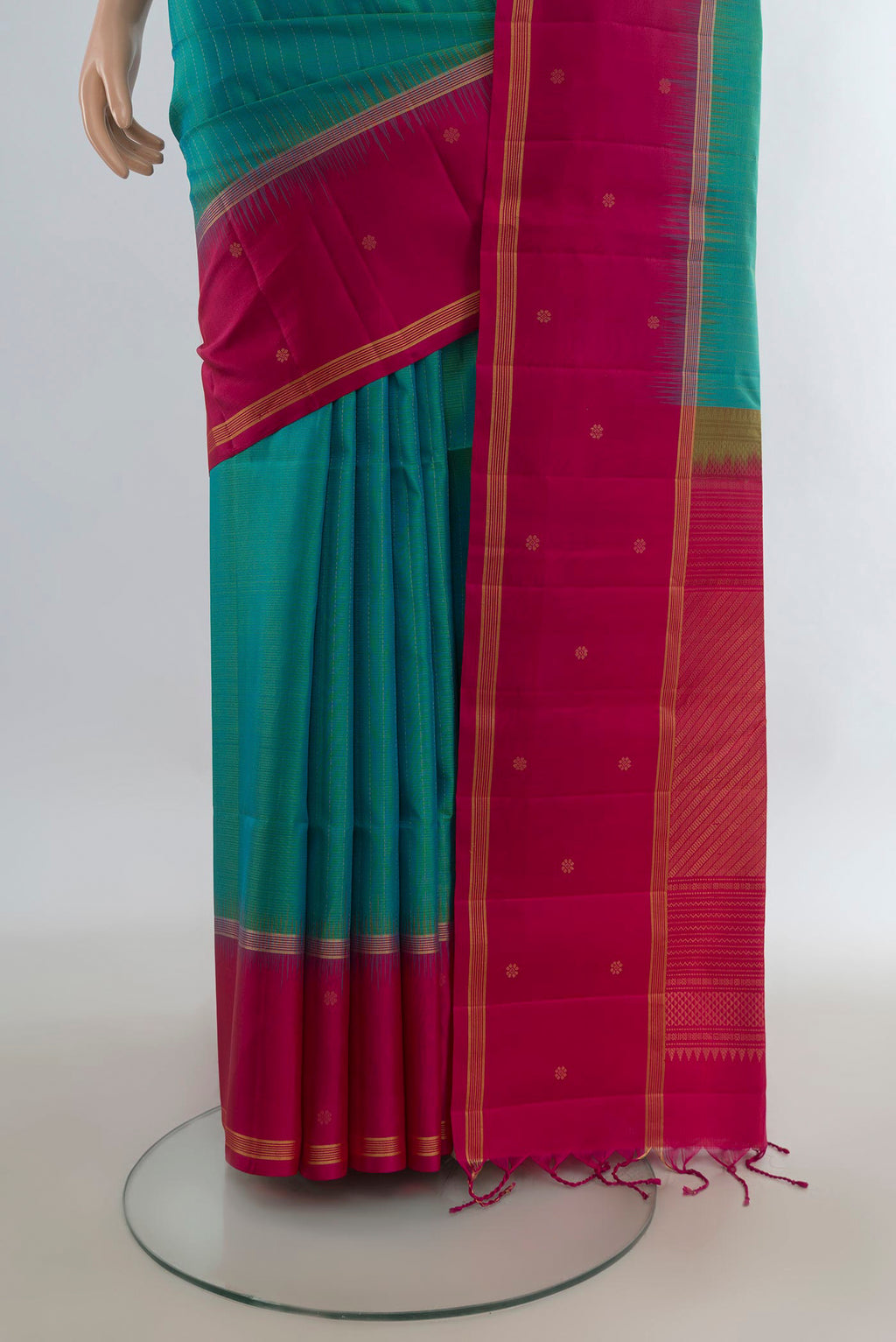 Pleats and pallu of Pure Silk Turquoise Soft Saree with Zari Butta on the body and Plain Border. 
