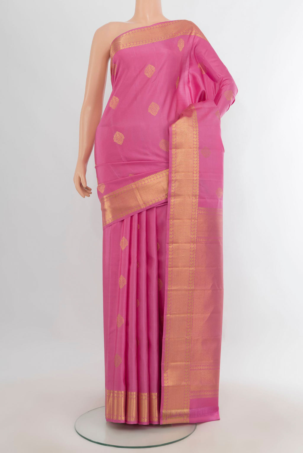 Pure Silk Rose pink Kanjivaram Saree with Zari Butta on the body and Zari Border.  displayed on a mannequin