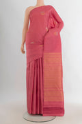 Pure Silk Coral Soft Saree with Zari Butta on the body and Without Border.  displayed on a mannequin