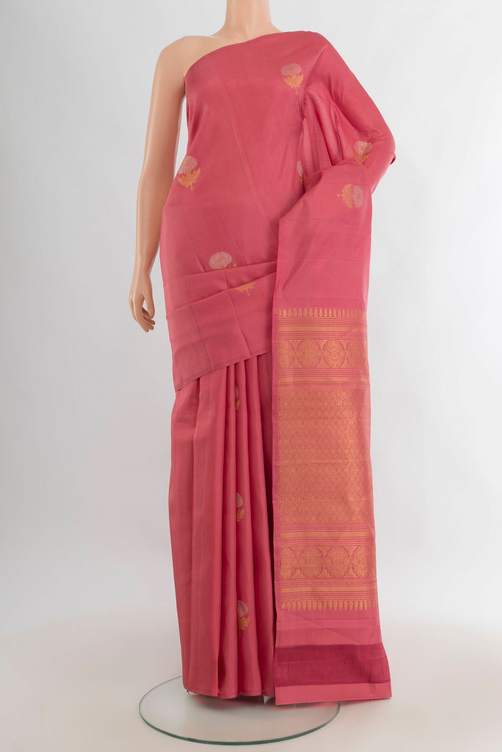 Pure Silk Coral Soft Saree with Zari Butta on the body and Without Border.  displayed on a mannequin