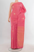 Pure Silk Coral Kanchipuram Saree with Zari Butta on the body and Without Border.  displayed on a mannequin