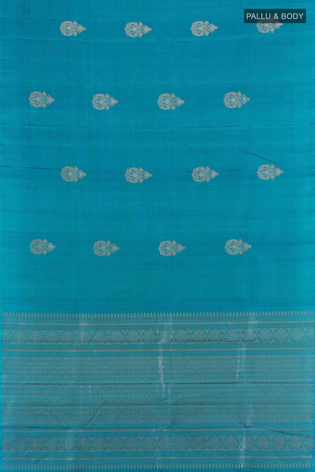 Flat view of Pure Silk Peacock Blue Soft Saree with Zari Butta on the body and Without Border. 