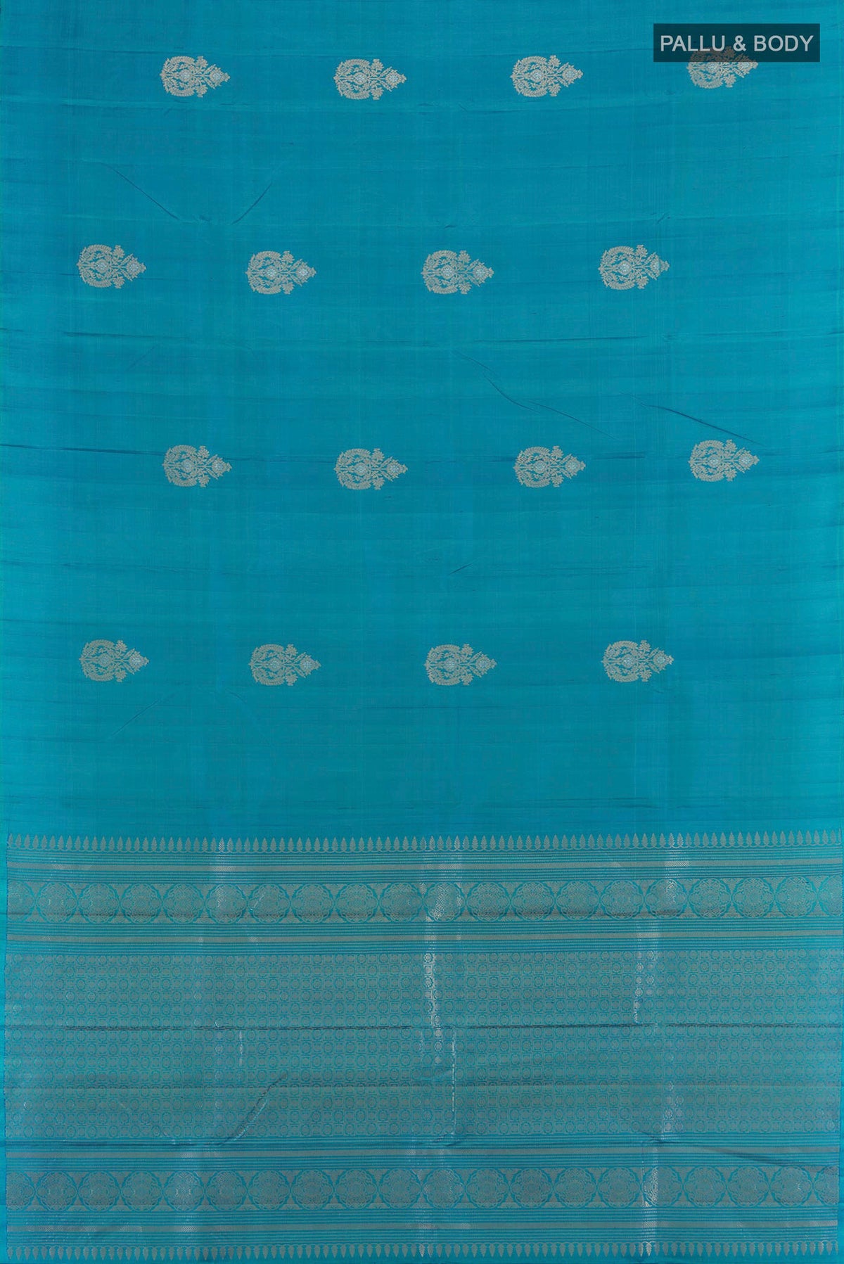 Flat view of Pure Silk Peacock Blue Soft Saree with Zari Butta on the body and Without Border. 