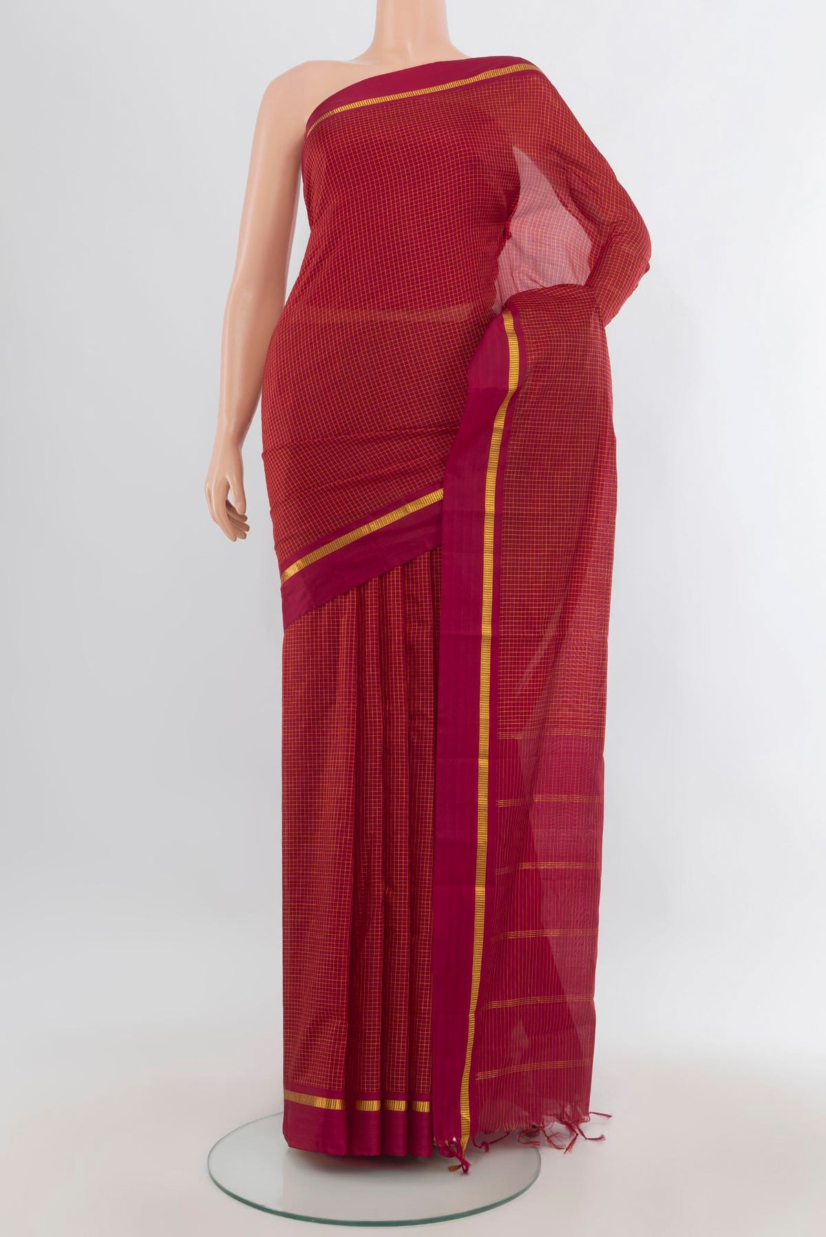 Pure Silk Red Kanjivaram Saree with Checked design on the body and Zari Border.  displayed on a mannequin