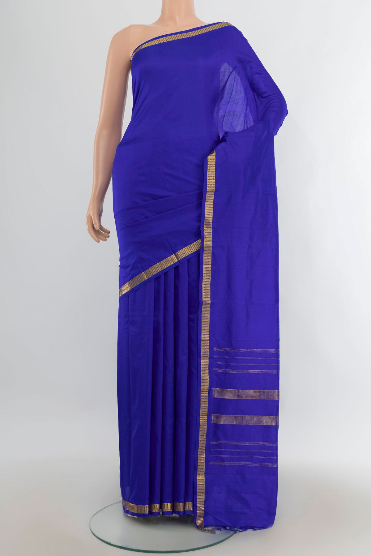 Pure Silk Dark Blue Kanjivaram Saree with Plain Body and Silk Border.  displayed on a mannequin