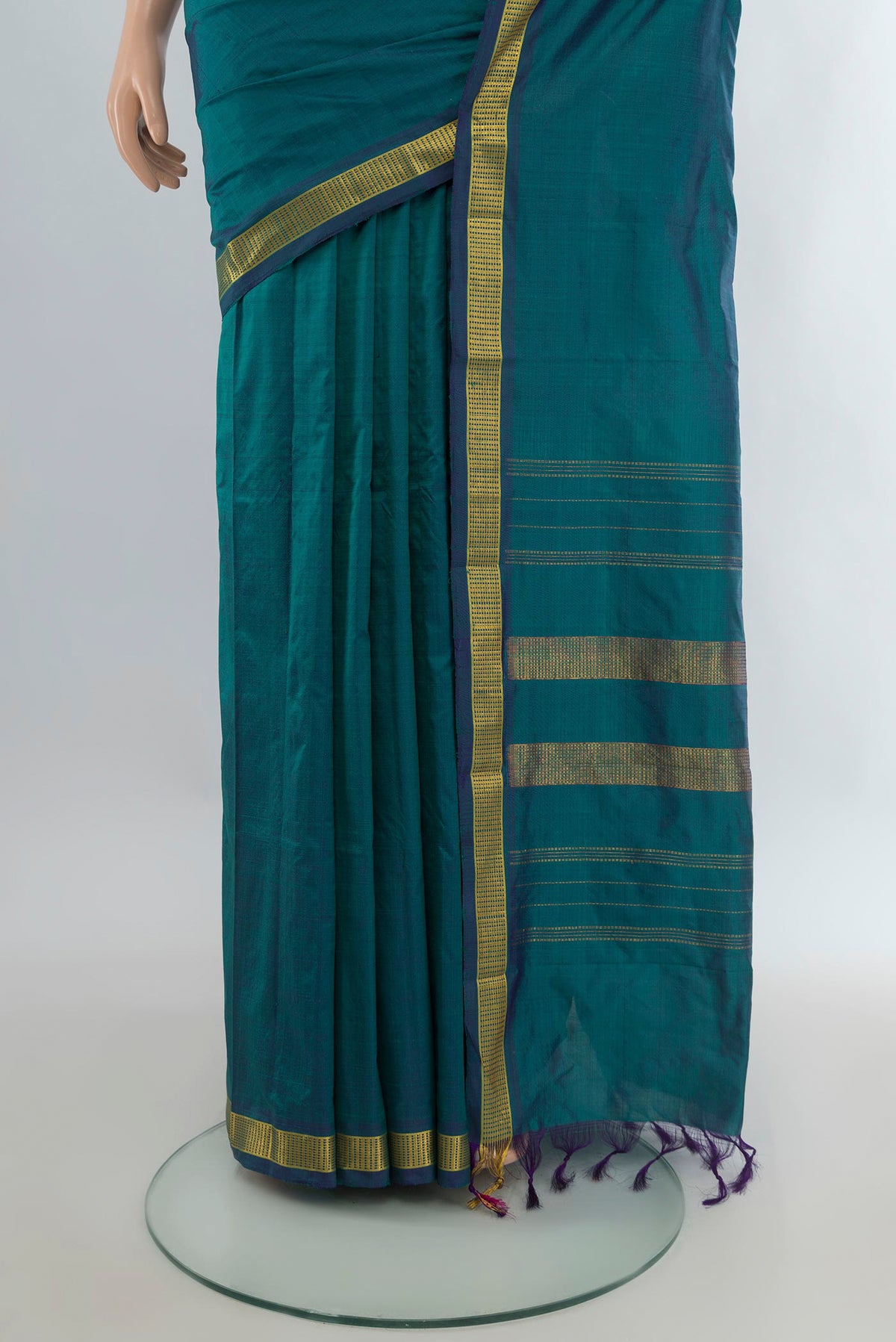 Pleats and pallu of Pure Silk Peacock Blue Kanjivaram Saree with Plain Body and Zari Border. 
