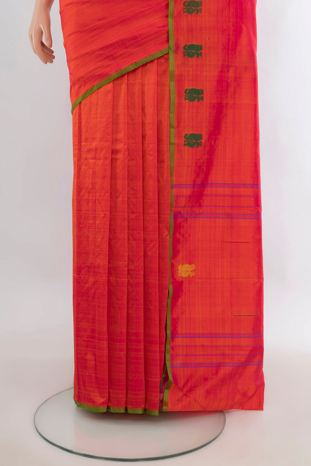 Pleats and pallu of Pure Silk Orange Kanchipuram Saree with Plain Body and Thread Border. 