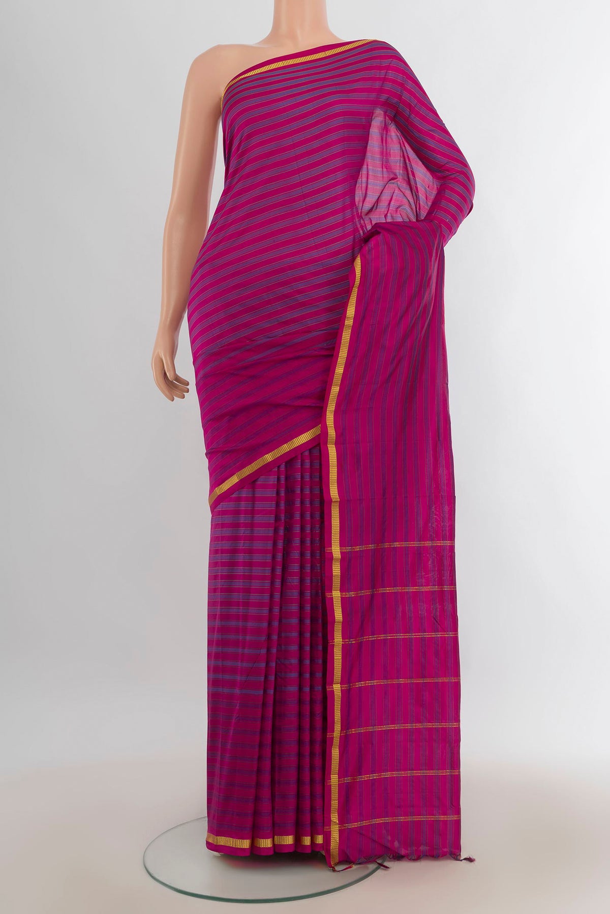 Pure Silk Multi Color Kanchipuram Saree with Checked design on the body and Silk Border.  displayed on a mannequin