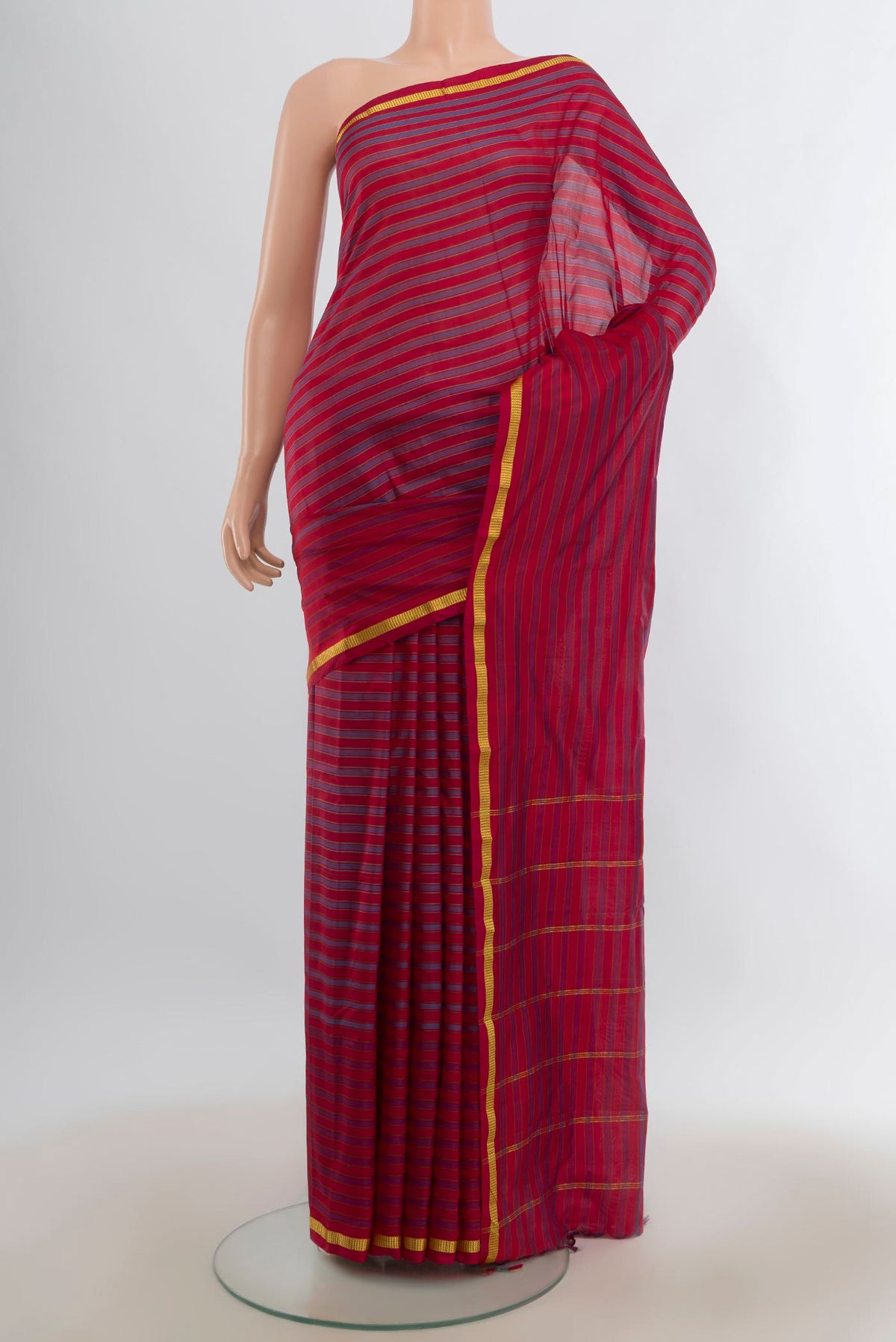 Pure Silk Multi Color Kanchipuram Saree with Stripes on the body and Zari Border.  displayed on a mannequin