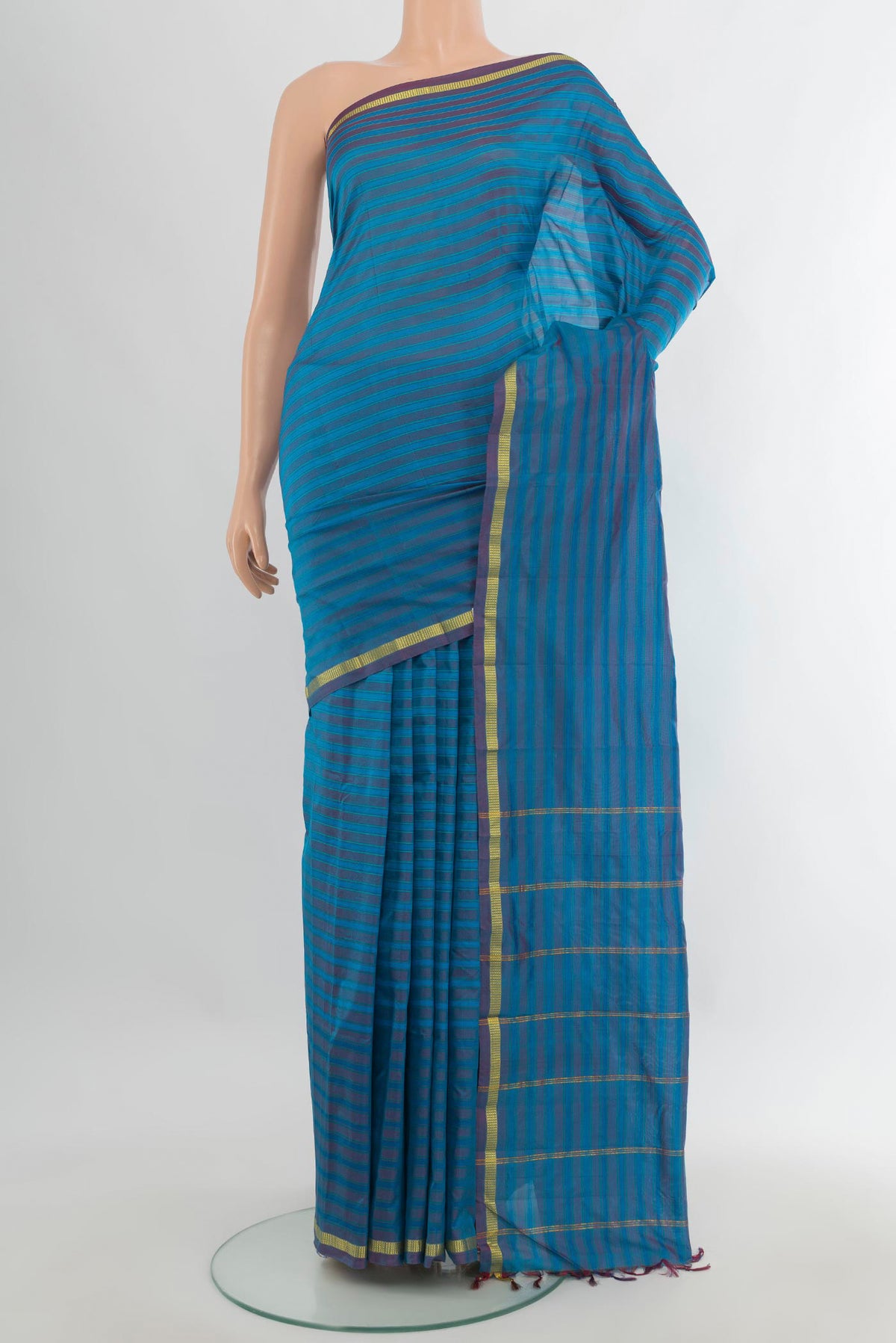 Pure Silk Blue Kanchipuram Saree with Stripes on the body and Zari Border.  displayed on a mannequin