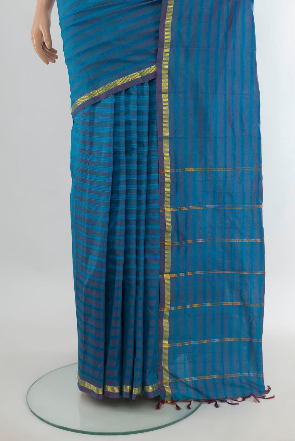 Pleats and pallu of Pure Silk Blue Kanchipuram Saree with Stripes on the body and Zari Border. 