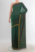 Pure Silk Multi Color Kanchipuram Saree with Checked design on the body and Silk Border.  displayed on a mannequin