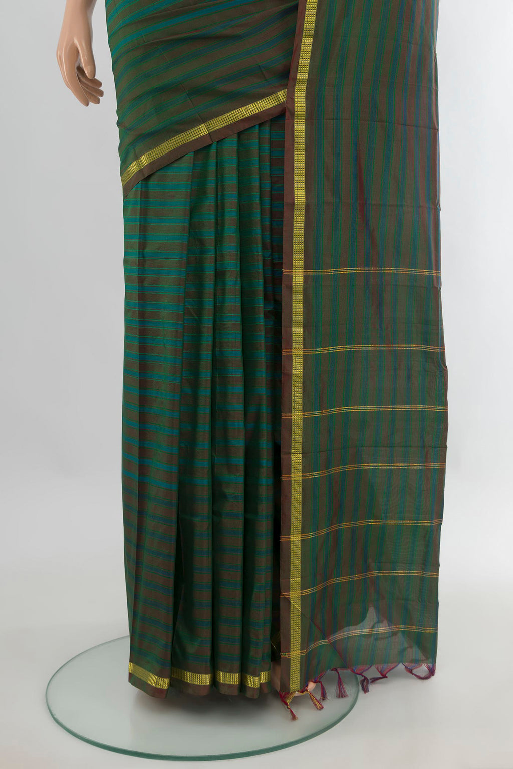 Pleats and pallu of Pure Silk Green Kanchipuram Saree with Stripes on the body and Zari Border. 