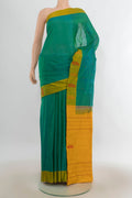 Pure Silk Sea Green Kanchipuram Saree with Plain Body and Plain Border.  displayed on a mannequin