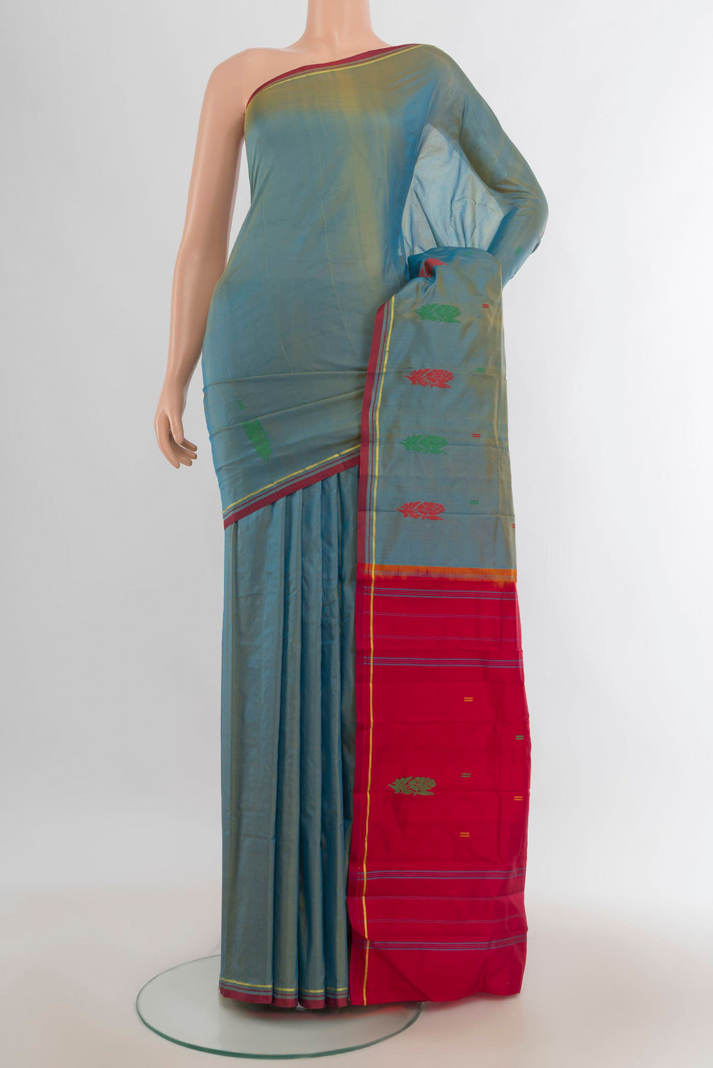 Pure Silk Light Blue Kanchipuram Saree with Thread Butta on the body and Silk Border.  displayed on a mannequin