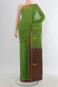 Pure Silk Light Green Kanchipuram Saree with Plain Body and Thread Border.  displayed on a mannequin