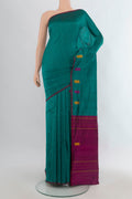 Pure Silk Green Kanchipuram Saree with Plain Body and Thread Border.  displayed on a mannequin