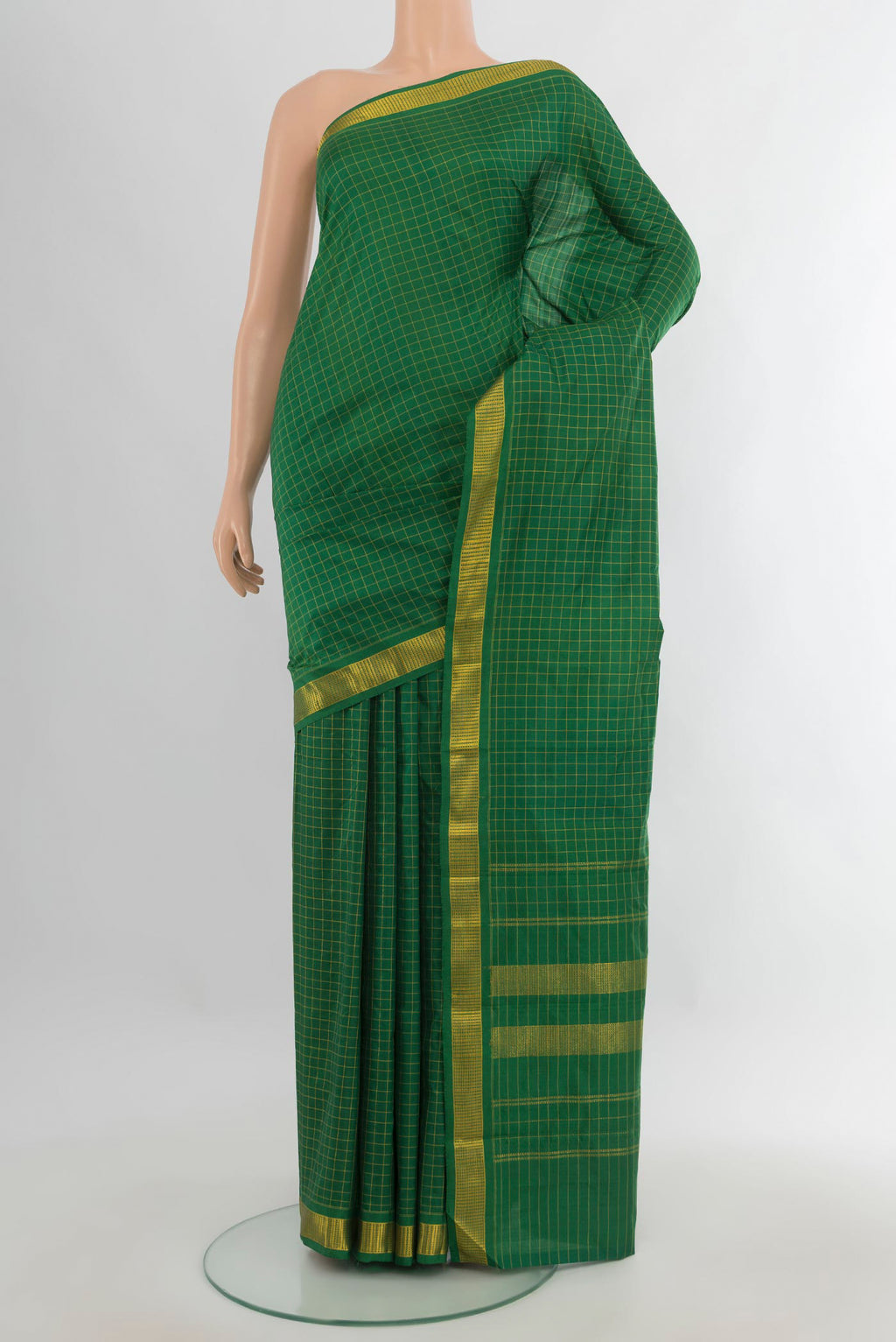 Pure Silk Green Kanjivaram Saree with Checked design on the body and Zari Border.  displayed on a mannequin