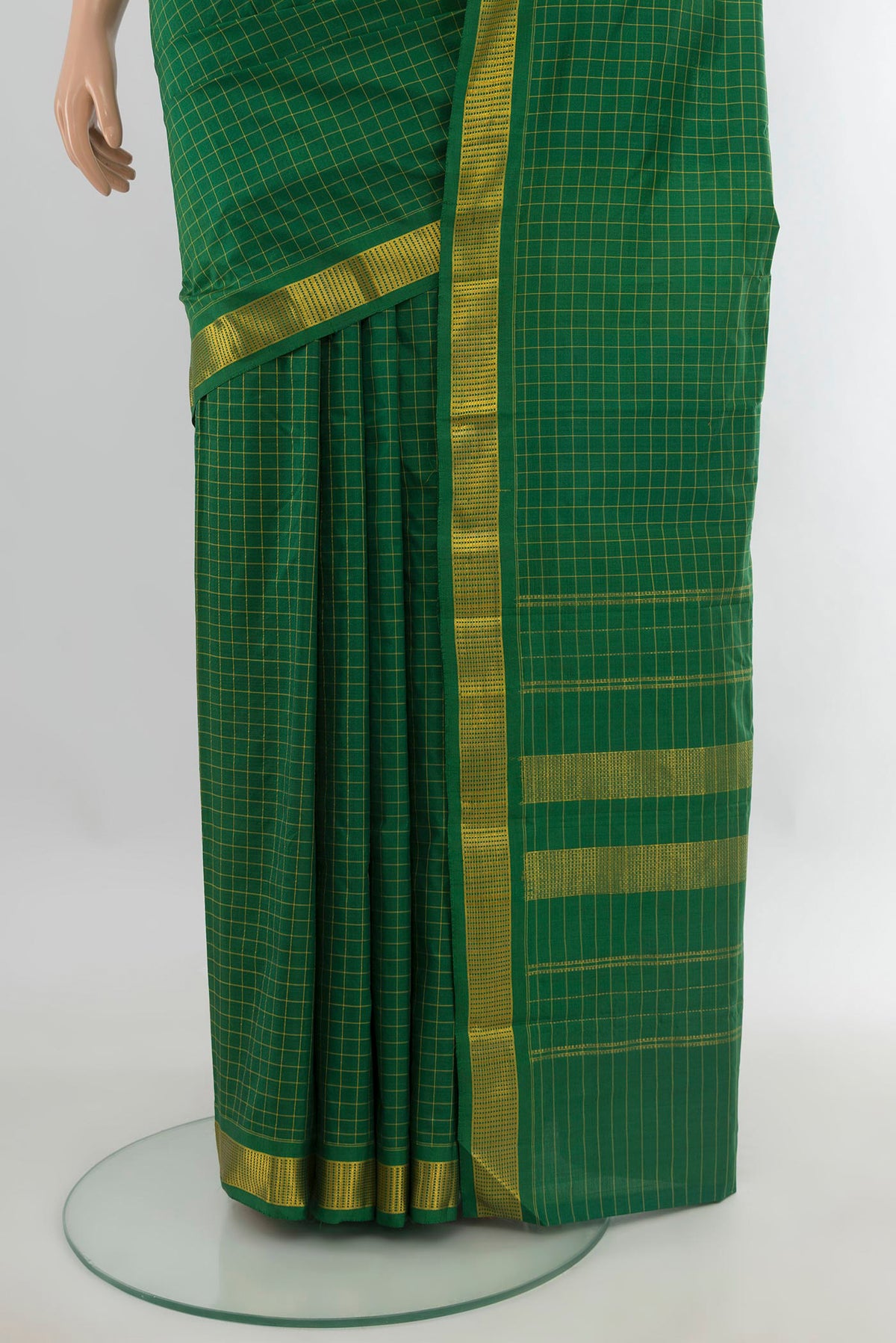Pleats and pallu of Pure Silk Green Kanjivaram Saree with Checked design on the body and Zari Border. 