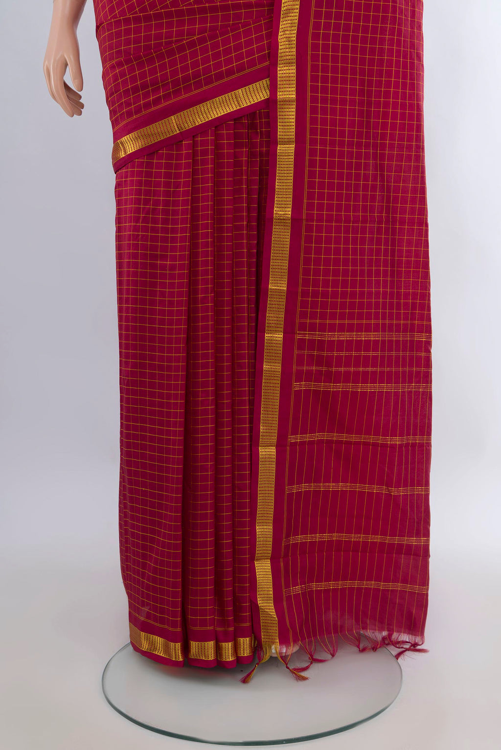 Pleats and pallu of Pure Silk Maroon Kanjivaram Saree with Checked design on the body and Zari Border. 