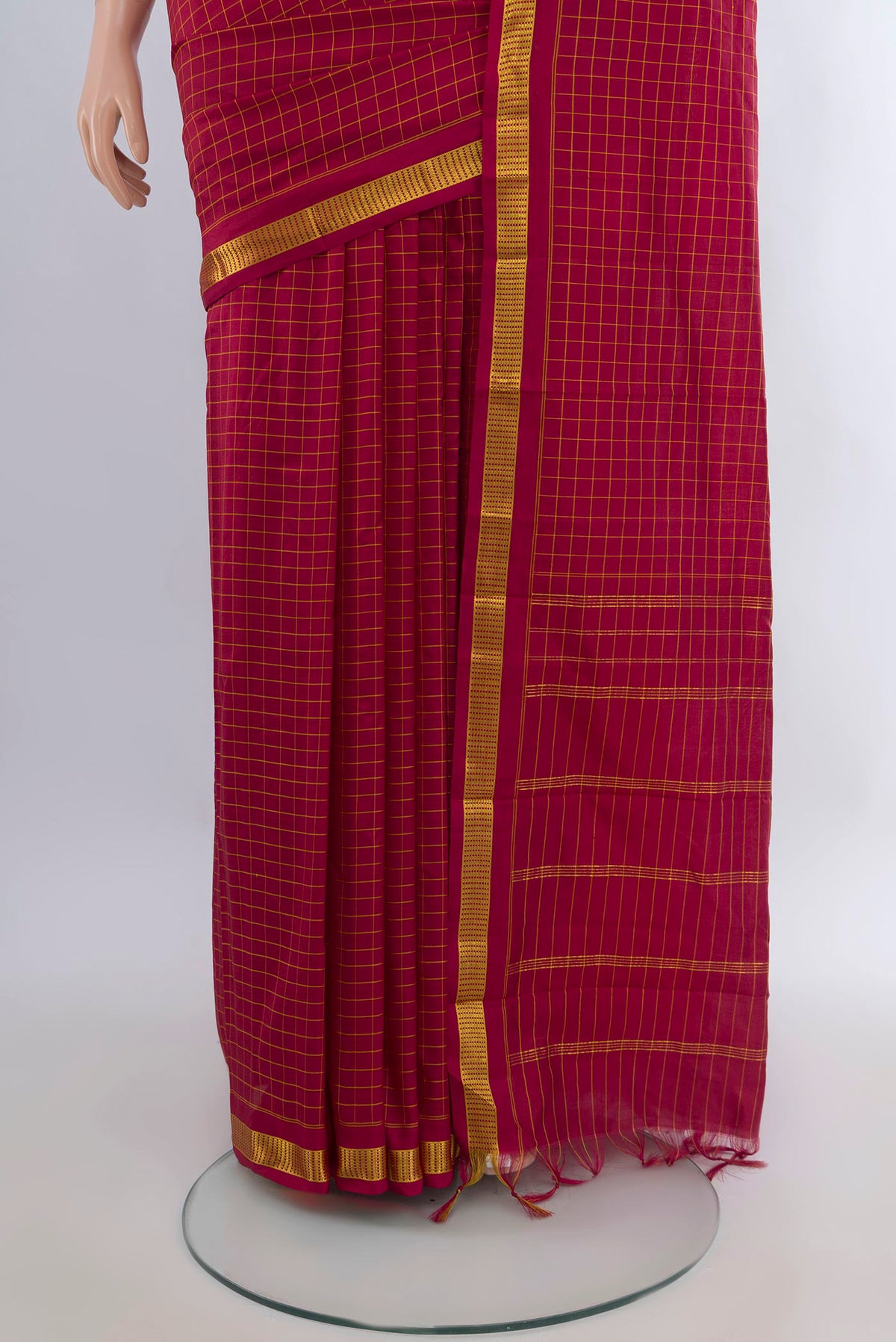 Pleats and pallu of Pure Silk Maroon Kanjivaram Saree with Checked design on the body and Zari Border. 