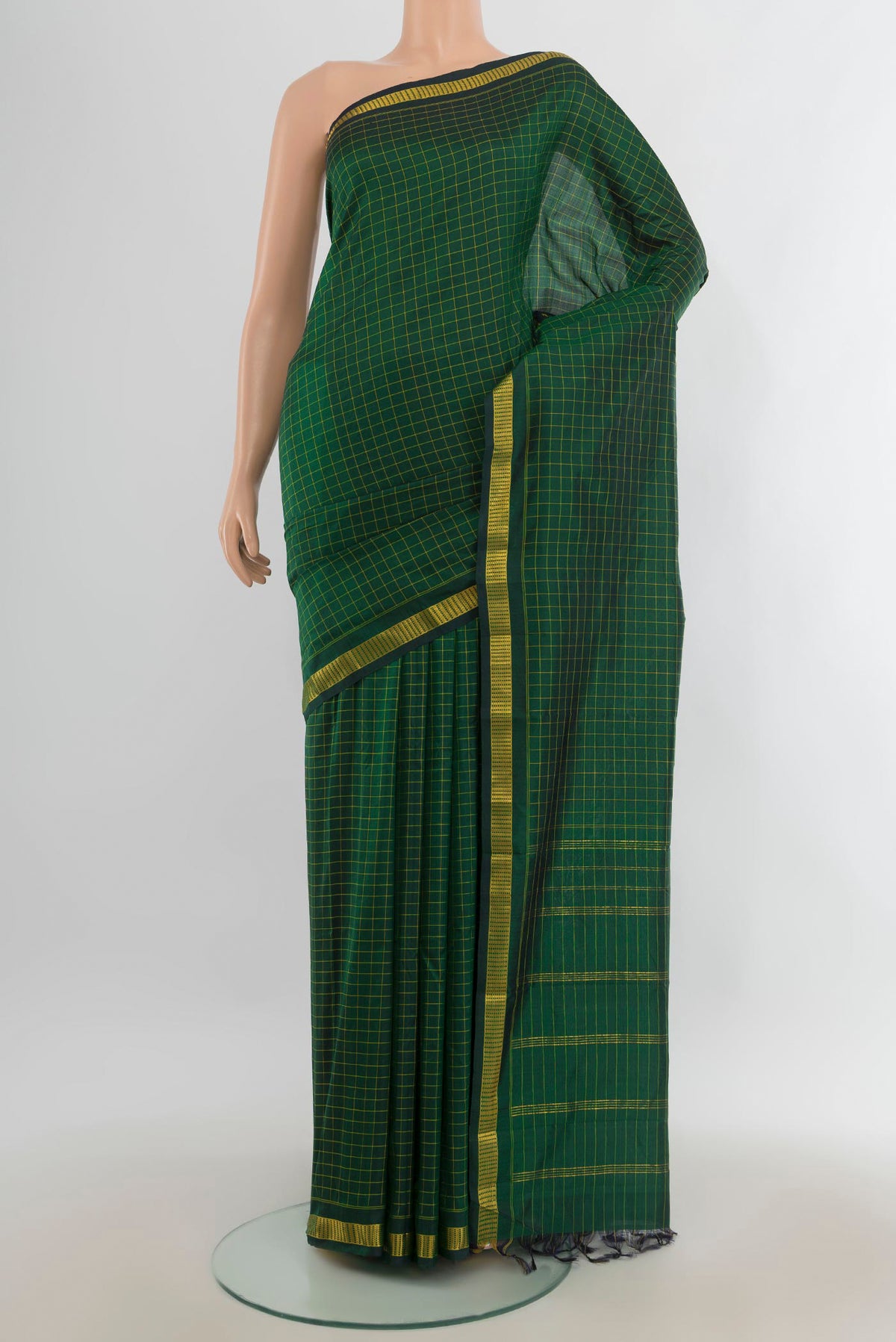 Pure Silk Mint Green Kanjivaram Saree with Checked design on the body and Silk Border.  displayed on a mannequin