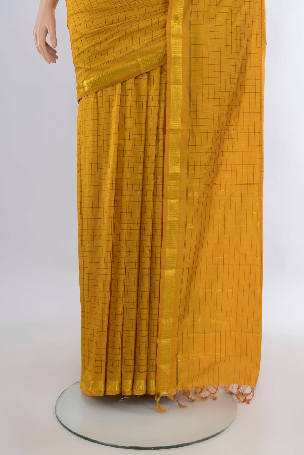 Pleats and pallu of Pure Silk Mustard Kanjivaram Saree with Checked design on the body and Zari Border. 