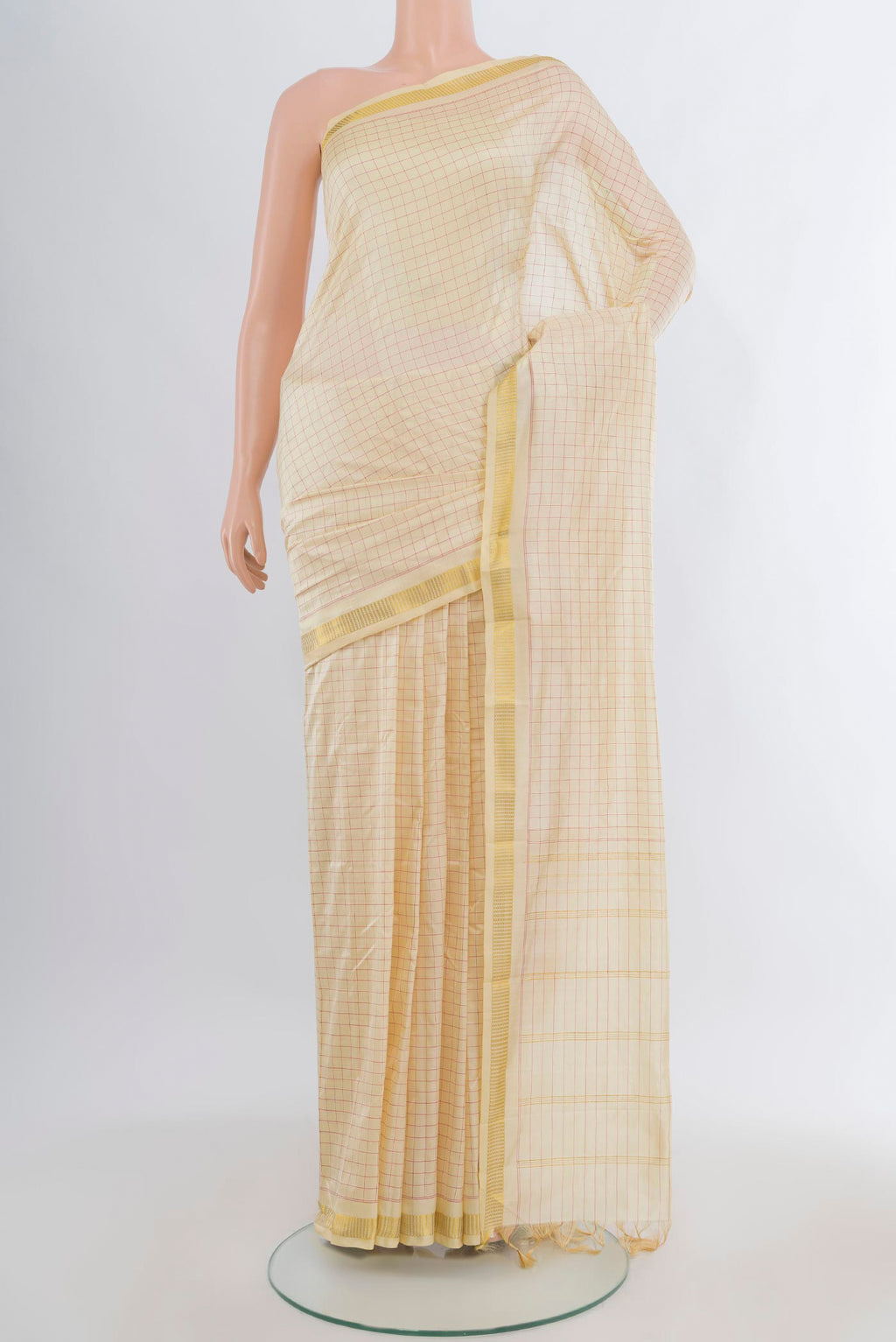 Pure Silk Cream Kanjivaram Saree with Checked design on the body and Zari Border.  displayed on a mannequin