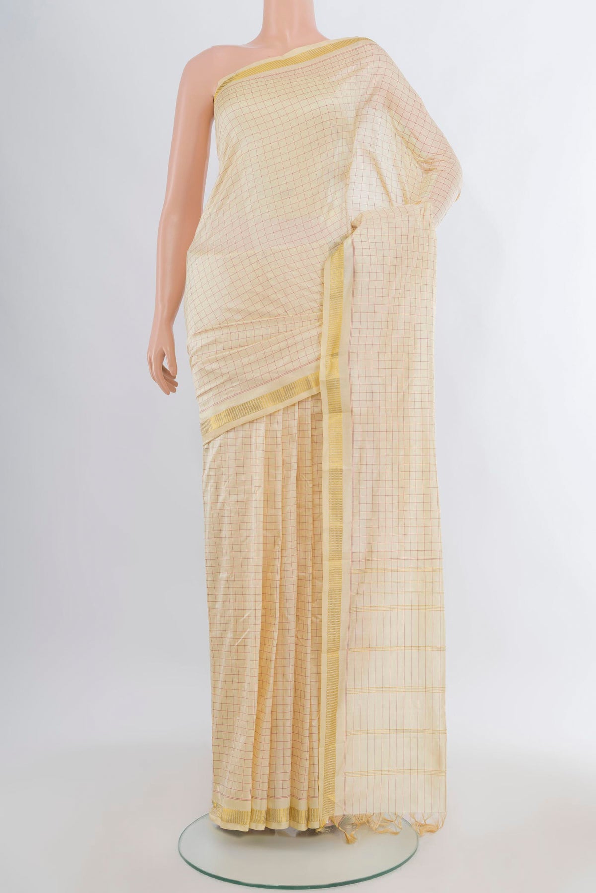 Pure Silk Cream Kanjivaram Saree with Checked design on the body and Zari Border.  displayed on a mannequin