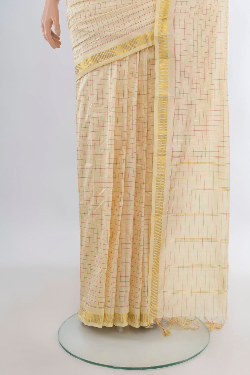 Pleats and pallu of Pure Silk Cream Kanjivaram Saree with Checked design on the body and Zari Border. 