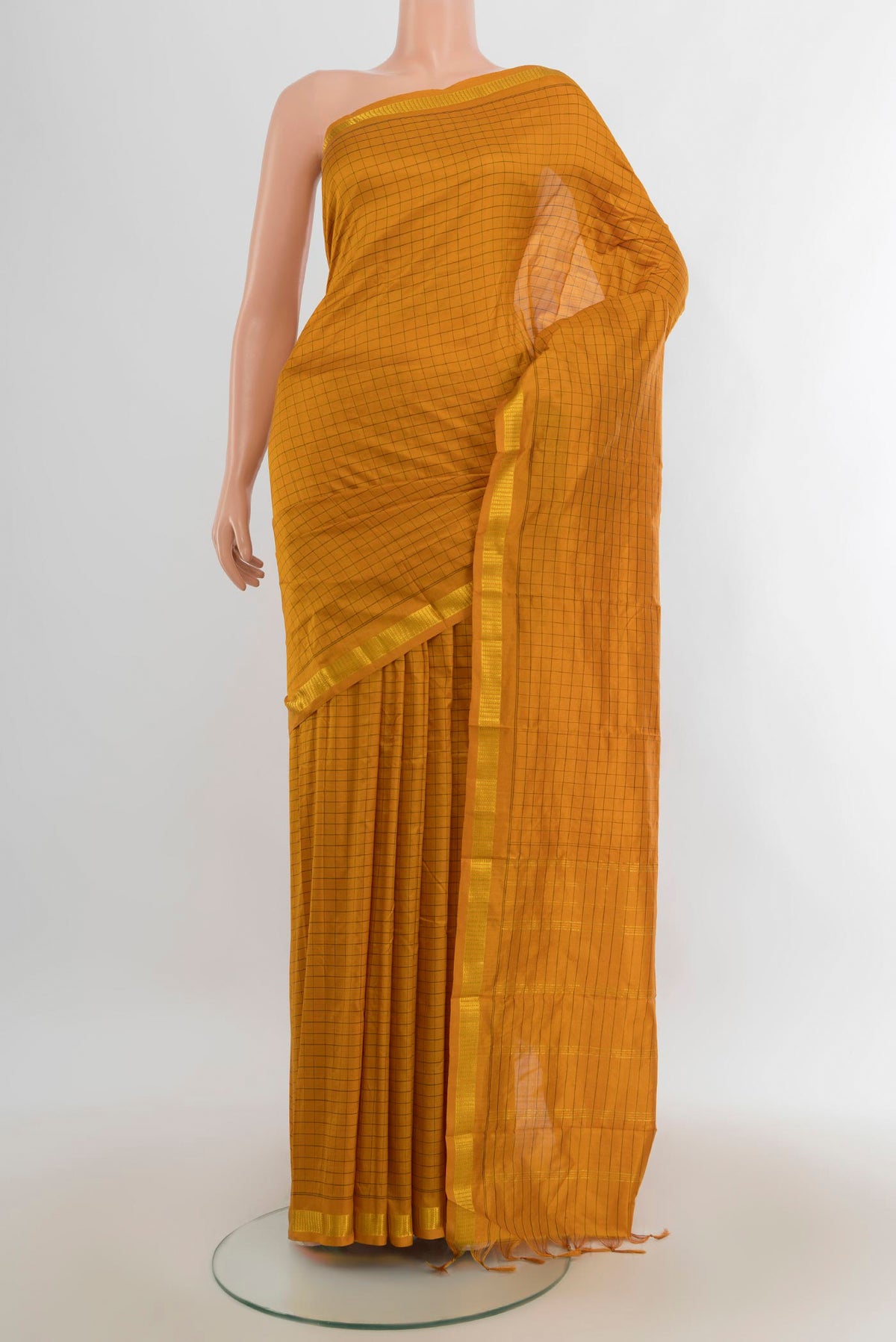 Pure Silk Mustard Kanjivaram Saree with Checked design on the body and Silk Border.  displayed on a mannequin