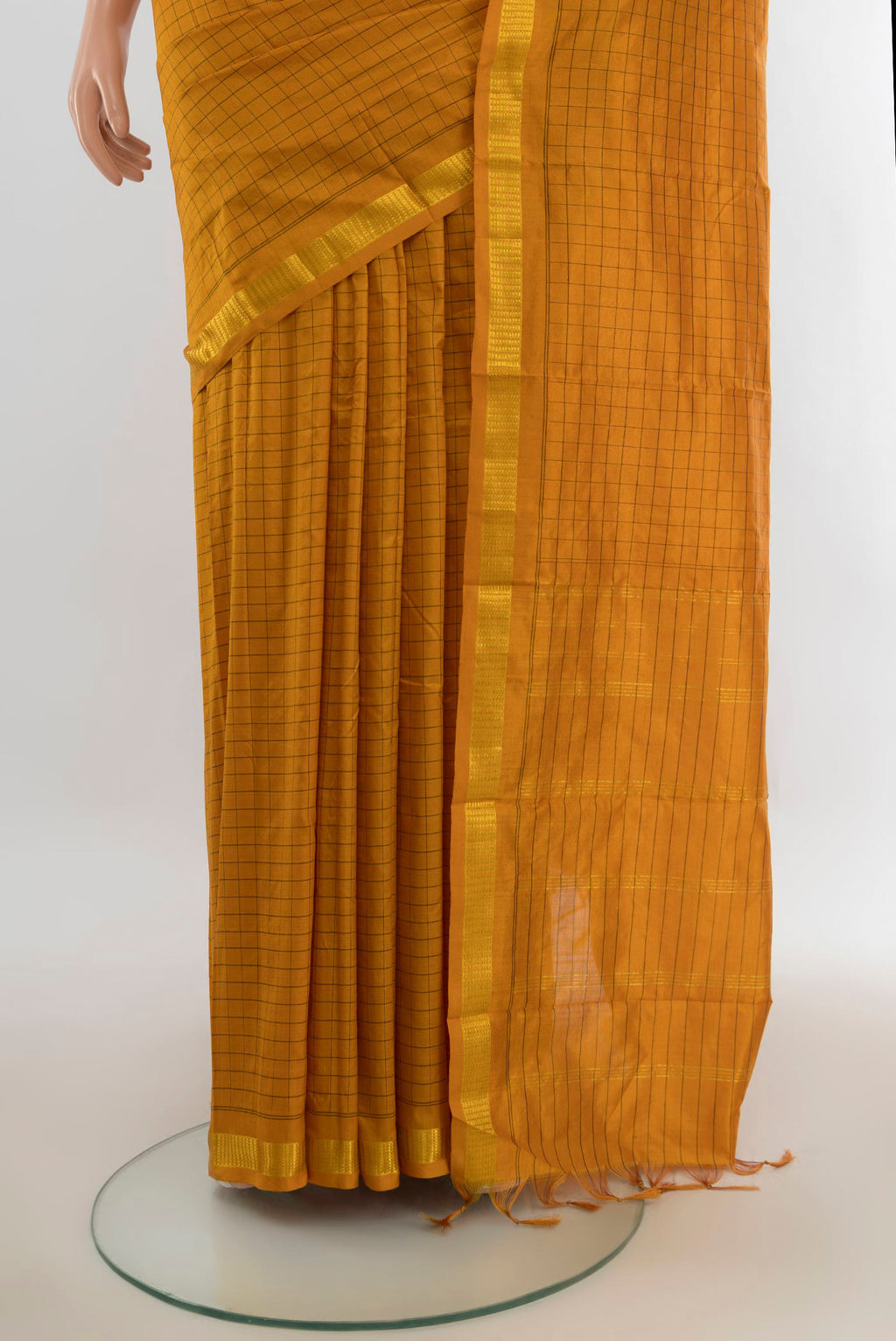 Pleats and pallu of Pure Silk Mustard Kanjivaram Saree with Checked design on the body and Silk Border. 