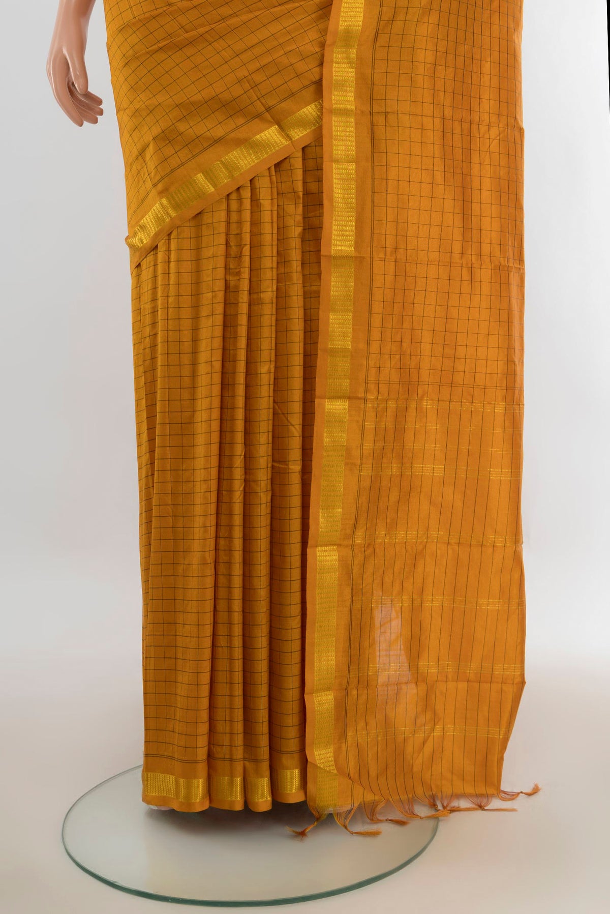 Pleats and pallu of Pure Silk Mustard Kanjivaram Saree with Checked design on the body and Silk Border. 