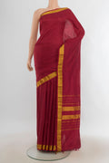 Pure Silk Maroon Kanjivaram Saree with Plain Body and Silk Border.  displayed on a mannequin