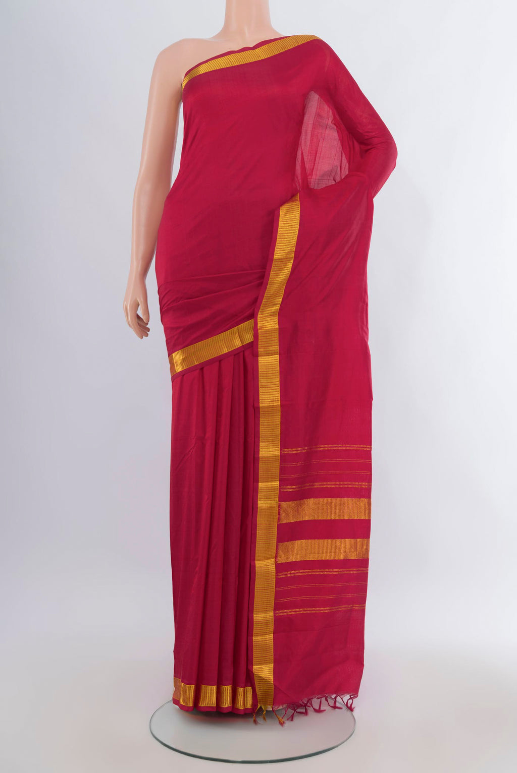 Pure Silk Deep Red Kanjivaram Saree with Plain Body and Zari Border.  displayed on a mannequin