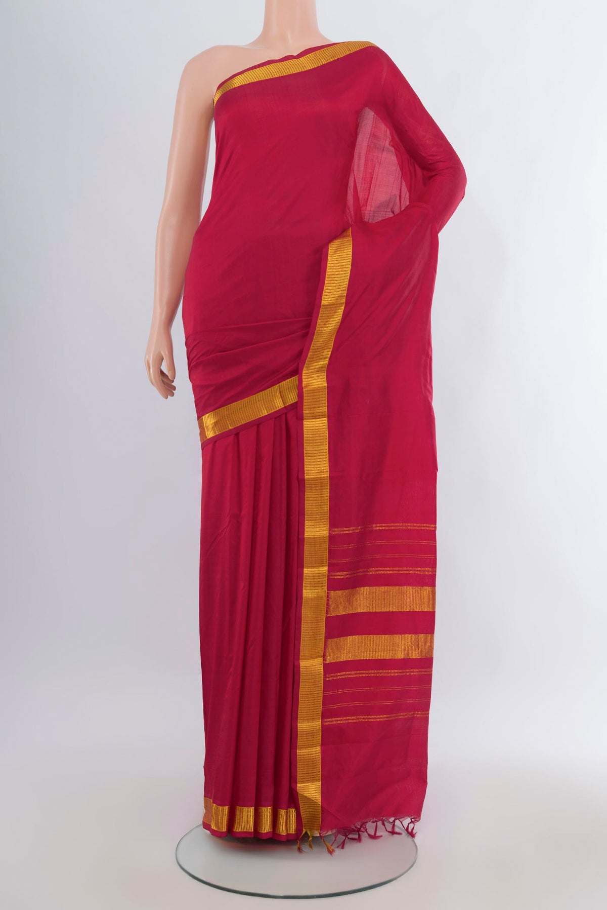 Pure Silk Deep Red Kanjivaram Saree with Plain Body and Zari Border.  displayed on a mannequin