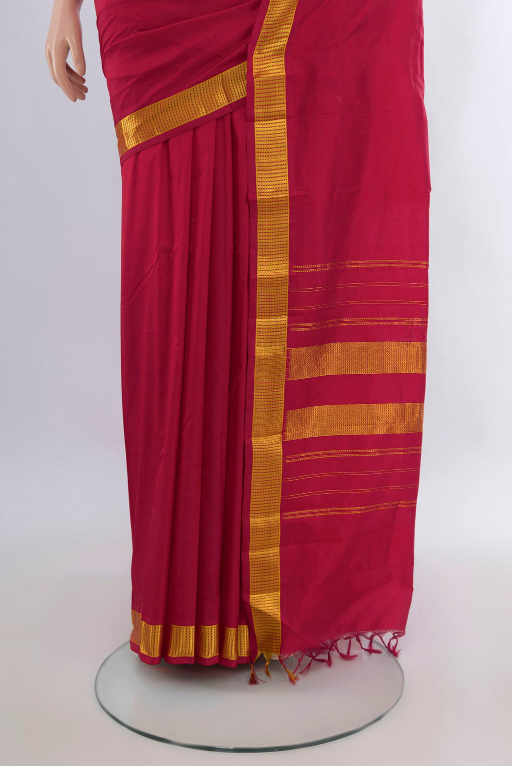 Pleats and pallu of Pure Silk Deep Red Kanjivaram Saree with Plain Body and Zari Border. 