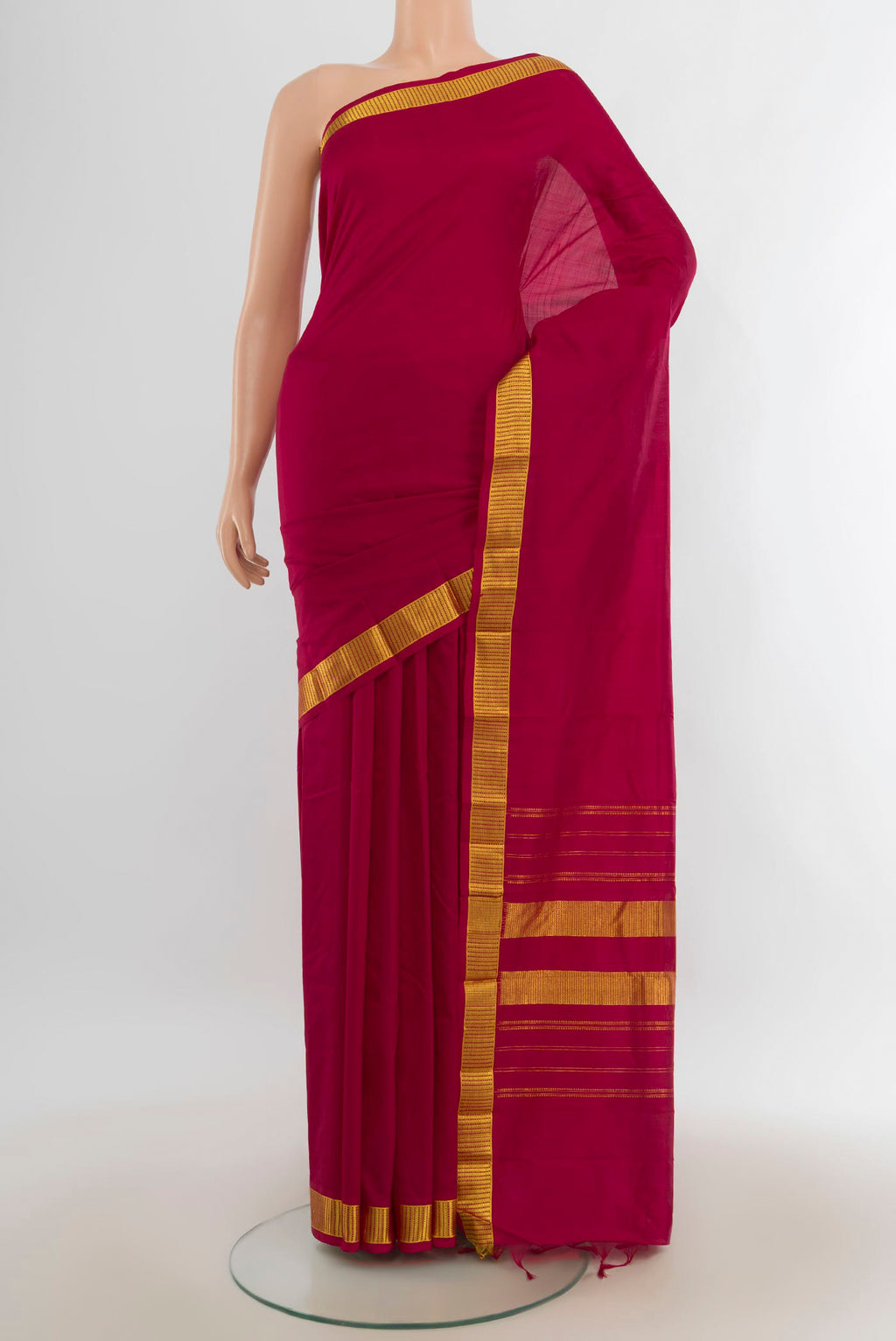 Pure Silk Maroon Kanjivaram Saree with Plain Body and Silk Border.  displayed on a mannequin