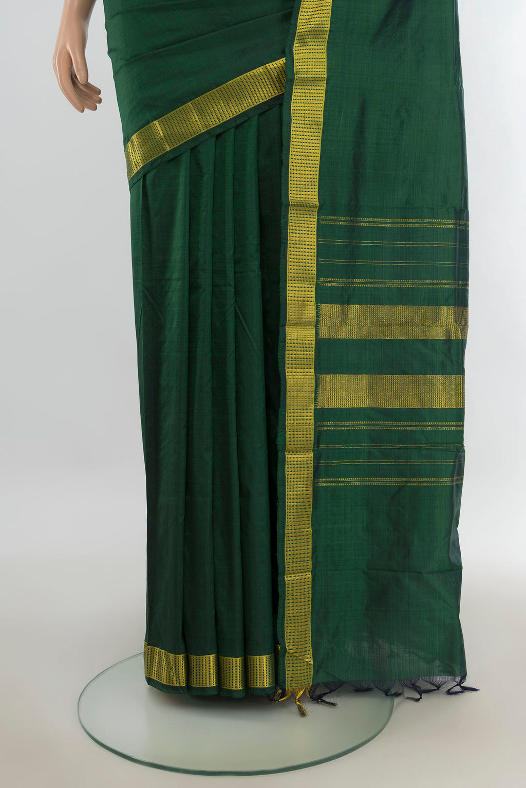 Pleats and pallu of Pure Silk Bottle Green Kanjivaram Saree with Plain Body and Silk Border. 