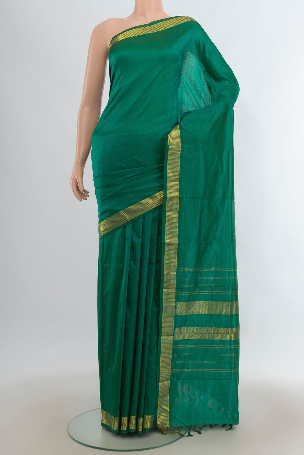 Pure Silk Green Kanjivaram Saree with Plain Body and Zari Border.  displayed on a mannequin