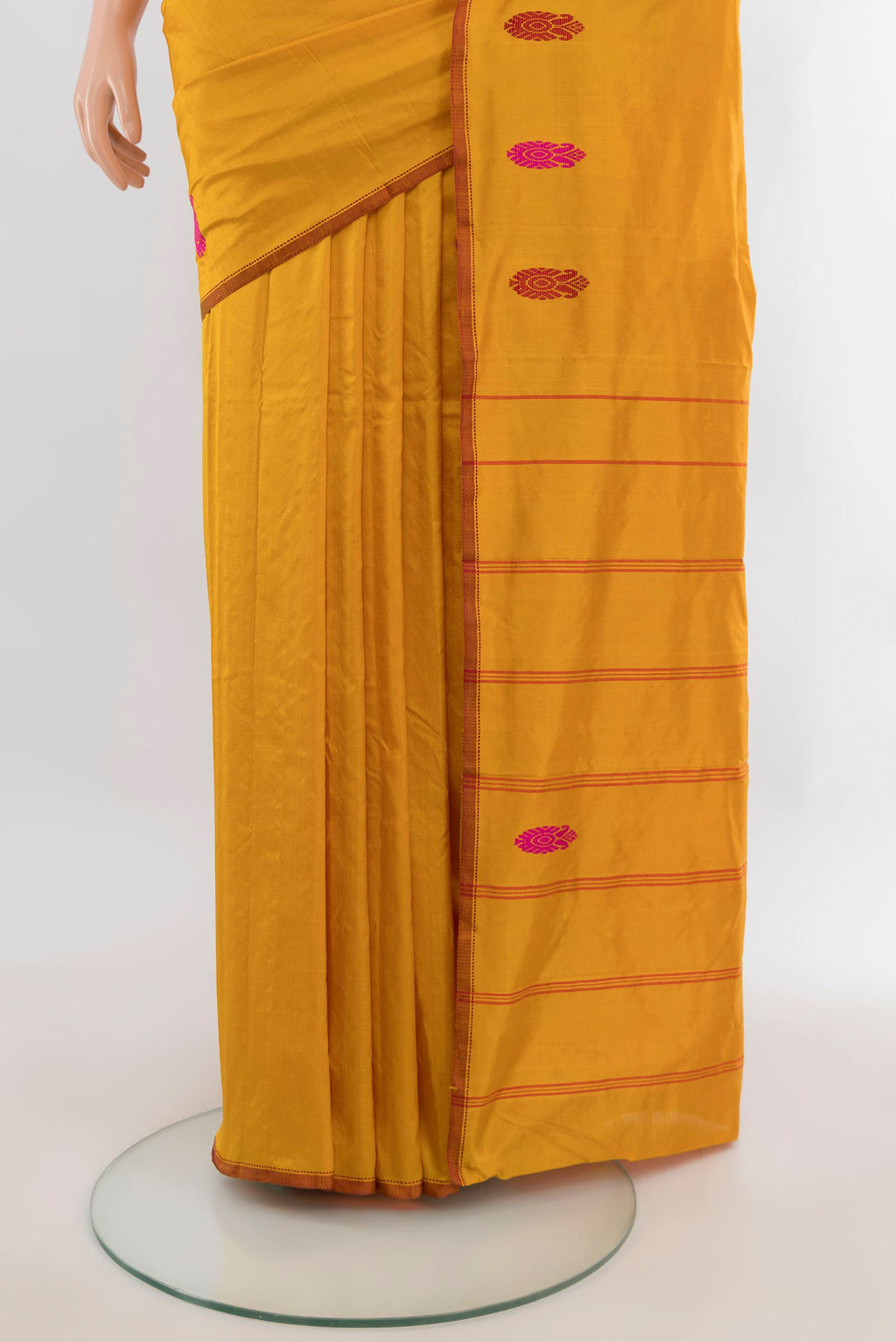 Pleats and pallu of Pure Silk Mustard Kanjivaram Saree with Plain Body and Zari And Thread Border. 
