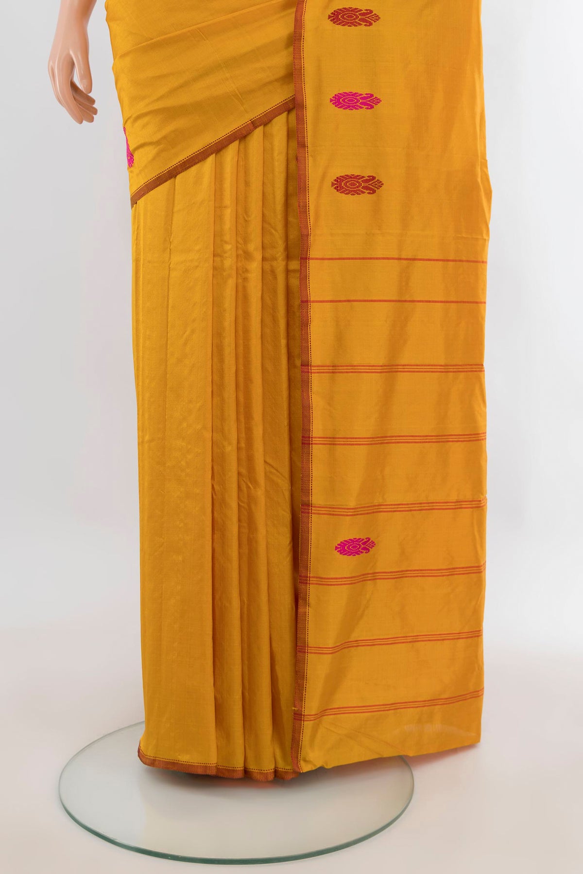Pleats and pallu of Pure Silk Mustard Kanjivaram Saree with Plain Body and Zari And Thread Border. 