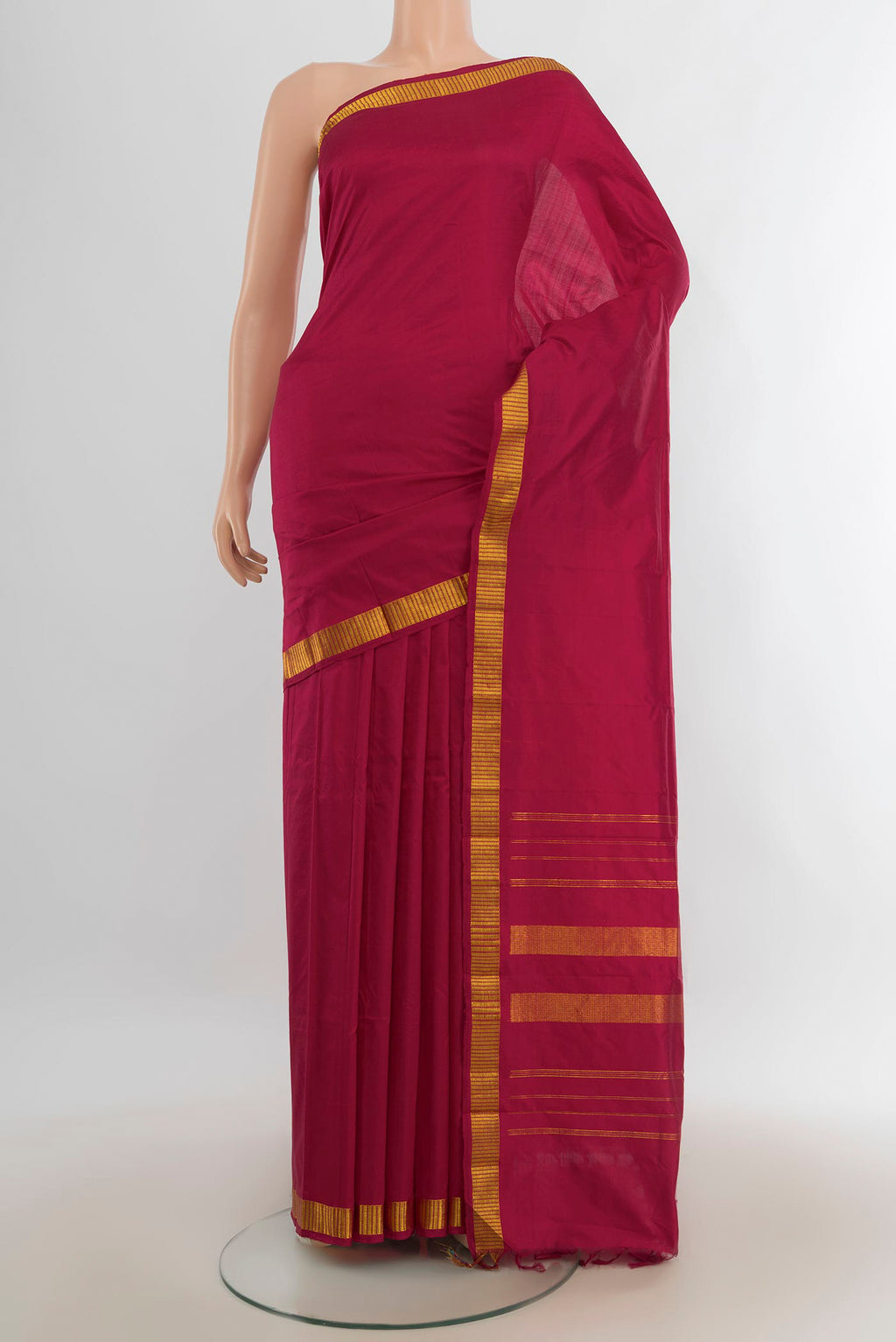 Pure Silk Dark Pink Kanjivaram Saree with Plain Body and Silk Border.  displayed on a mannequin
