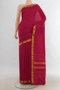 Pure Silk Dark Pink Kanjivaram Saree with Plain Body and Silk Border.  displayed on a mannequin