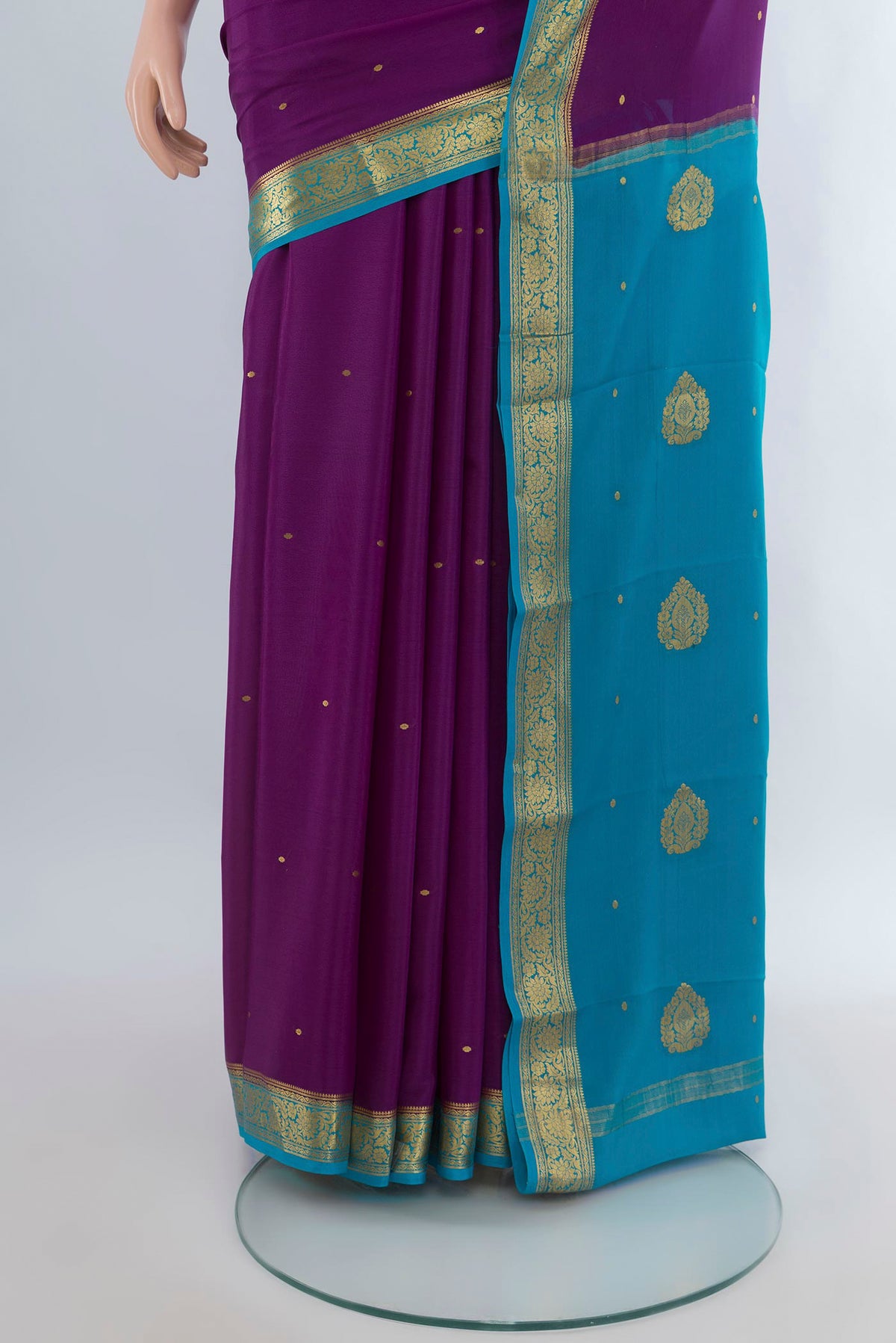 Pleats and pallu of Purple Mysore Crepe Saree with Zari Butta on the body and Zari Border. 