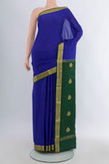 Royal Blue Mysore Crepe Saree with Zari Butta on the body and Zari Border.  displayed on a mannequin