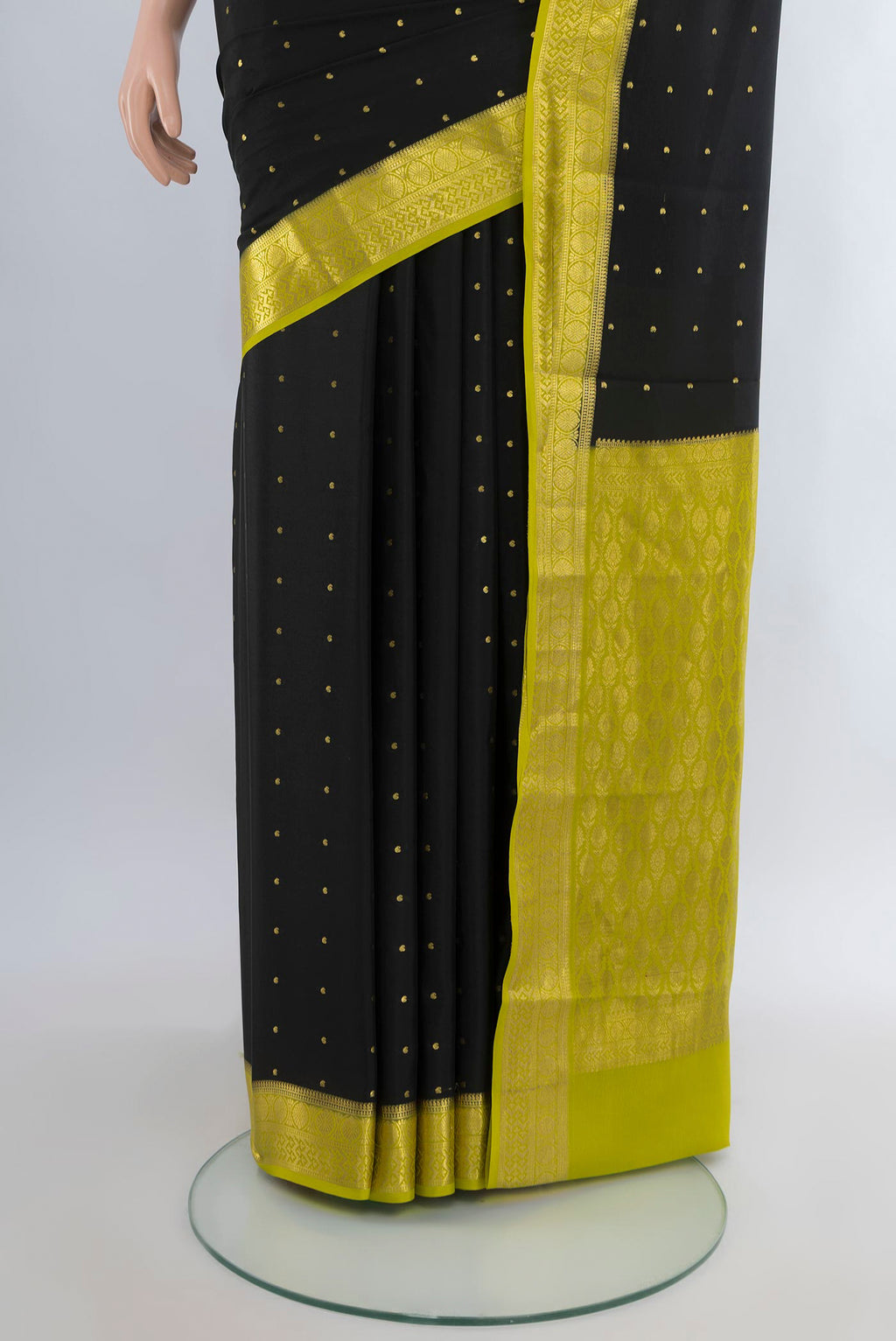 Pleats and pallu of Black Mysore Crepe Saree with Zari Butta on the body and Zari Border. 