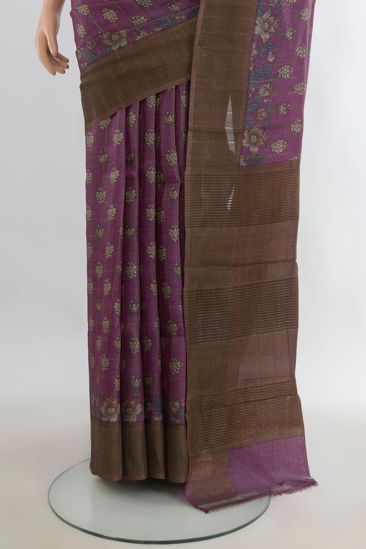 Pleats and pallu of Purple Tussar Saree with Printed design on the body and Zari Border. 