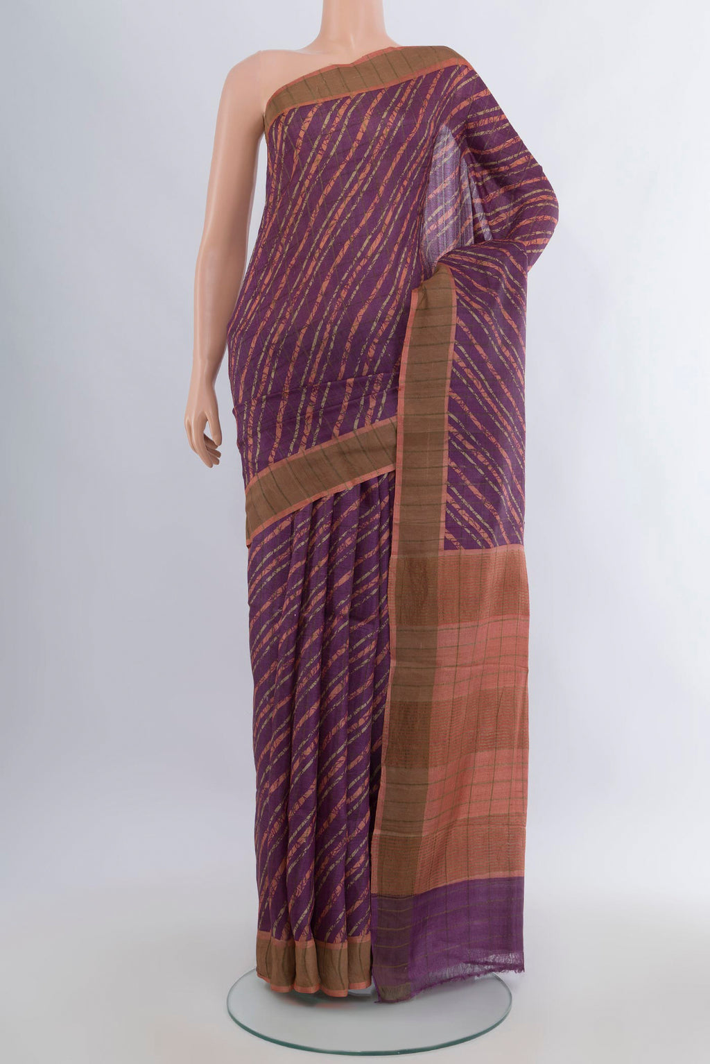 Mauve Tussar Saree with Floral Print on the body and Zari Border.  displayed on a mannequin